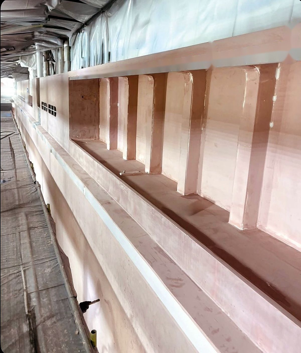 Fairing compound on a superyacht cabin side